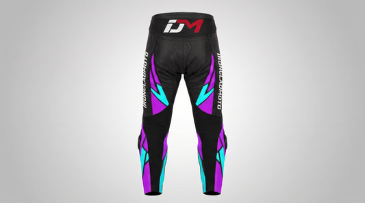 Black athletic pants with purple and teal geometric accents, featuring a red and white 'iDM' logo on the waistband and vertical branding on the legs, shown against a light gray gradient background.