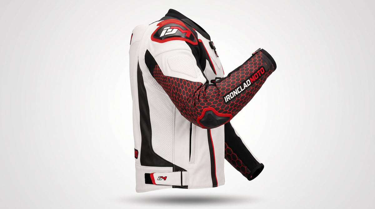 A white leather motorcycle jacket with black and red accents, shown from the side with one arm extended to display the matching red and black Ironclad Moto arm guard against a light gray background.